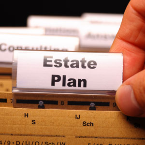 Hand holding a tab labeled 'Estate Plan' - Legal Advantage Group