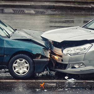 Two cars involved in an accident showing significant damage.